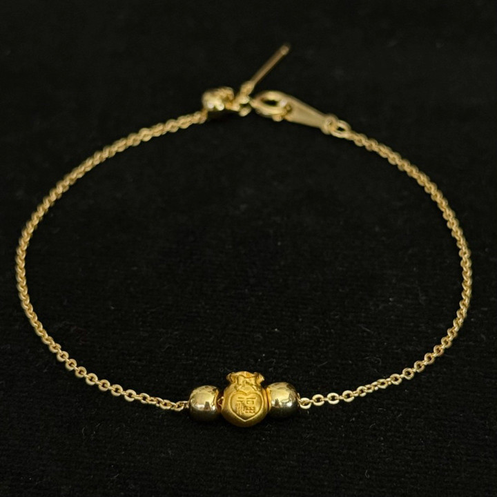 Bracelet de luxe en or avec breloques | Authentique et garanti