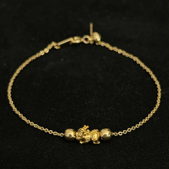 Bracelet de luxe en or avec breloques | Authentique et garanti